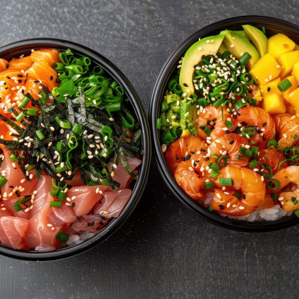 Two vibrant poke bowls, one with salmon and tuna, the other with shrimp, avocado, and mango.