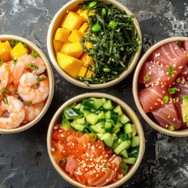 Four colorful poke bowls with shrimp, tuna, salmon, mango, seaweed, and cucumber.